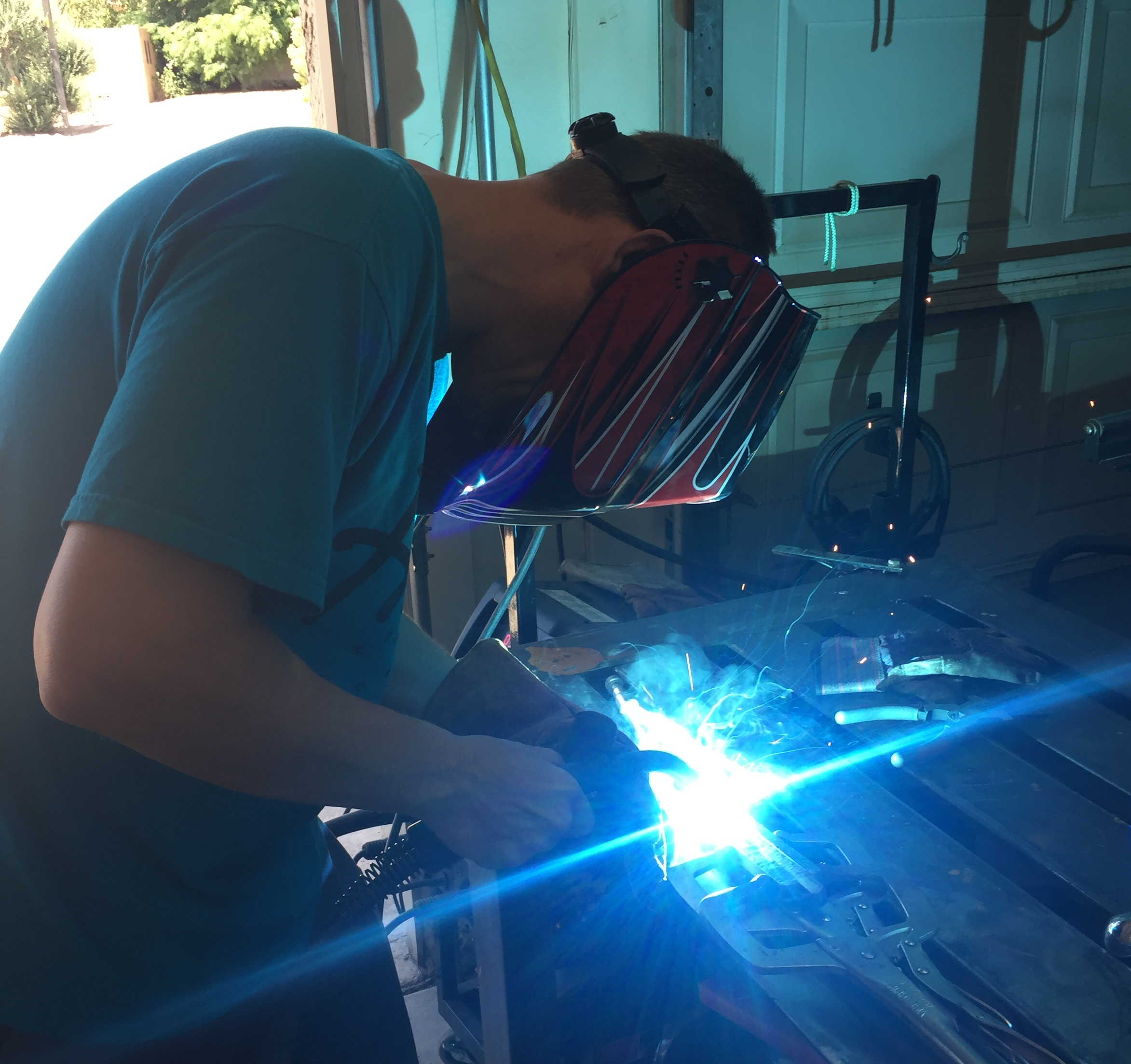 Bill welding in his workshop